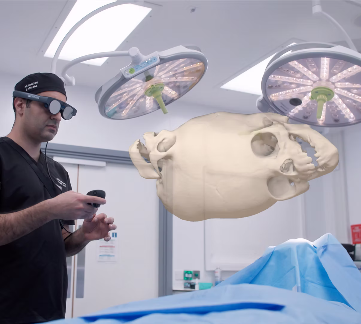 Dr. Ali Haddad reviewing a patient's digital twin in the operating theatre